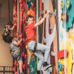 Kids climbing at Crazy Climb centre in Swansea.