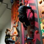 Couple practising their favoutrite indoor activities at Crazy Climb wall.